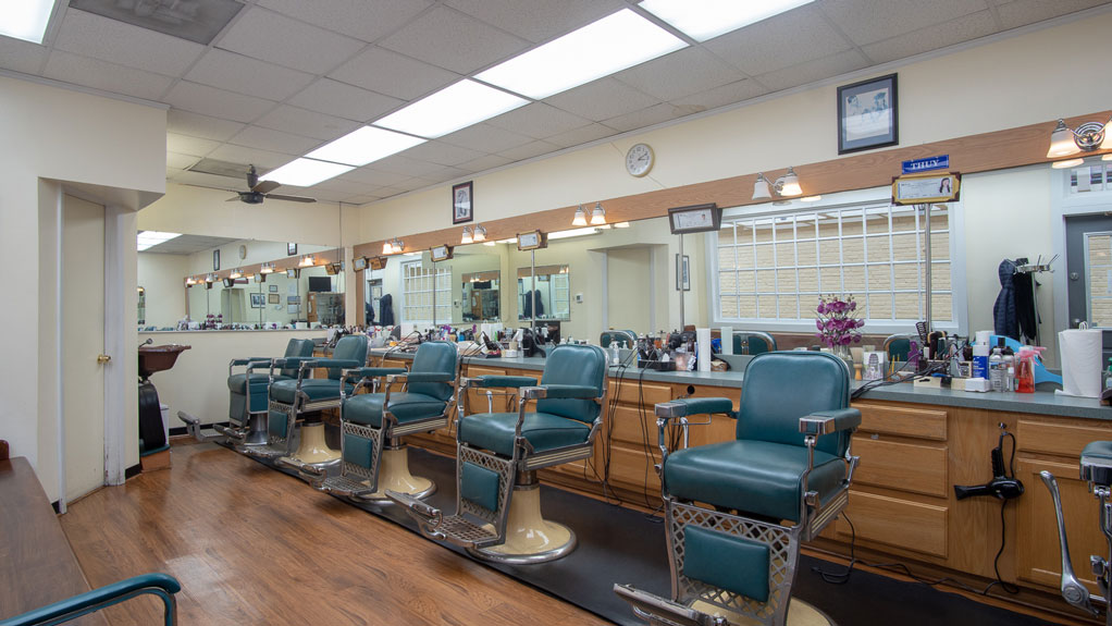 Wildwood Manor Barbershop interior with classic barber chairs and mirrors